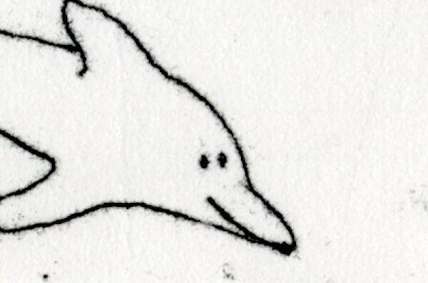 in the left center of the image is the front portion of a doodle of a dolphin. The lines on the top and bottom right side of the image suggest a possible repeating dolphin pattern.